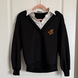 black sweater with bear patch and built in "layered" white collared shirt look